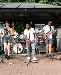 band playing live music outside at Whiskey Island